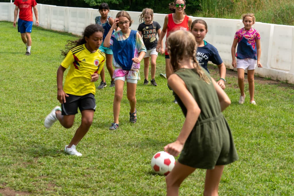 Campers enjoying sports activities at Camp Riverbend